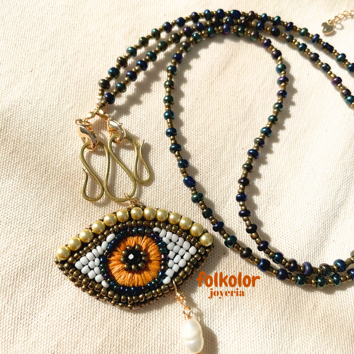 Ojo con perlas
